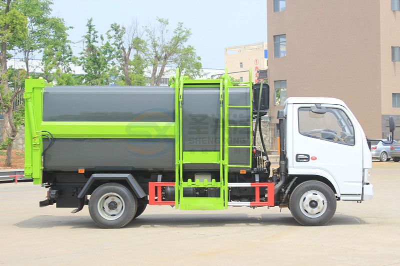 藍(lán)牌7.5方東風(fēng)多利卡壓縮式掛桶垃圾車