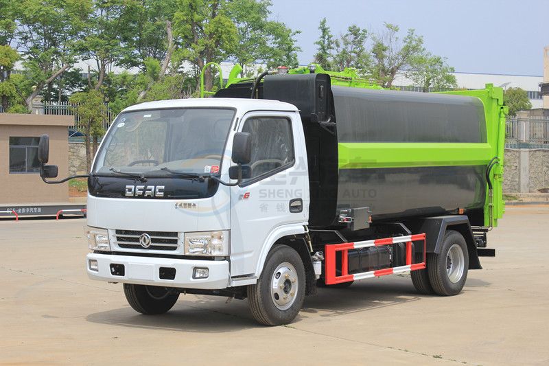 藍(lán)牌7.5方東風(fēng)多利卡壓縮式掛桶垃圾車